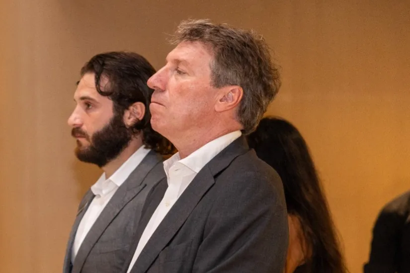 Two guests listening intently during the FinMet.sg launch