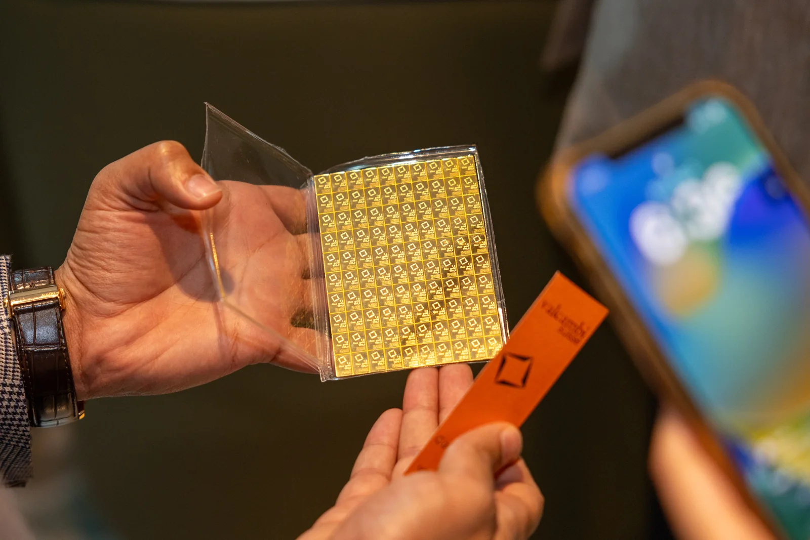 A physical gold CombiBar shown at the launch